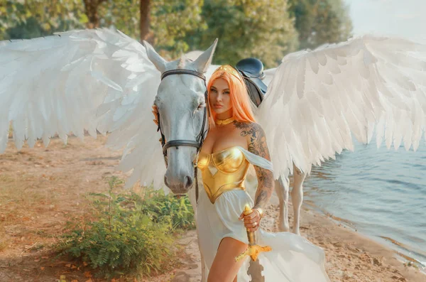 Art photo real people Fantasy woman warrior queen hand strocking white horse with wings pegasus animal. goddess girl sexy princess holds magic sword in hands. summer nature water river sea lake river.