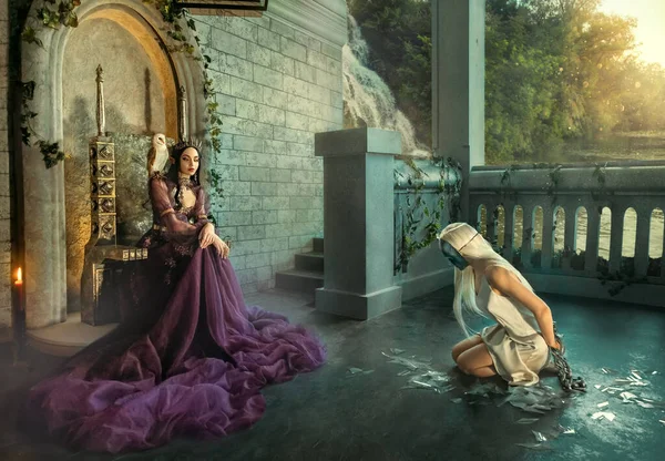 Artwork fantasy fairy evil insidious revenge woman queen sits on throne. Punishes captive girl princess metal chains. Shackles on hands , mask on face, kneels. Backdrop terrace medieval ancient room.