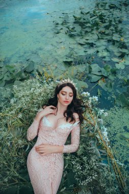 Art photo real person beauty sleeping woman resting in boat with willow branches leaves white flowers. Greek goddess Nymph Elf girl closed eyes, enjoy silence nature river. Fantasy fairy tale princess clipart