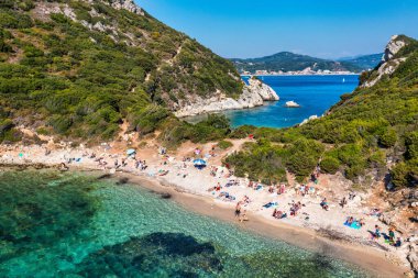 Porto Timoni is an amazing beautiful double beach in Corfu, Greece. Porto Timoni beach at Afionas is a paradise double beach with crystal clear azure water in Corfu, Ionian island, Greece, Europe