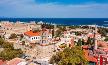 Panoramic view of Rhodes old town on Rhodes island, Greece. Rhodes old fortress cityscape with sea port at foreground. Travel destinations in Rhodes, Greece. clipart