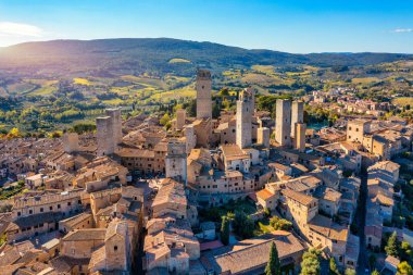 Town of San Gimignano, Tuscany, Italy with its famous medieval towers. Aerial view of the medieval village of San Gimignano, a Unesco World Heritage Site. Italy, Tuscany, Val d'Elsa.