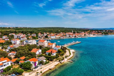 Petrcane village tourist destination coastline aerial panoramic view, Dalmatia region of Croatia. Aerial top view of village Petrcane, Croatia. Petrcane aerial view, Dalmatia region of Croatia