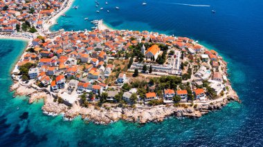 Aerial view of Primosten old town on the islet, Dalmatia, Croatia. Primosten, Sibenik Knin County, Croatia. Resort town on the Adriatic coast. Aerial view of adriatic town Primosten, Croatia