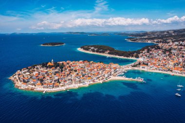 Aerial view of Primosten old town on the islet, Dalmatia, Croatia. Primosten, Sibenik Knin County, Croatia. Resort town on the Adriatic coast. Aerial view of adriatic town Primosten, Croatia