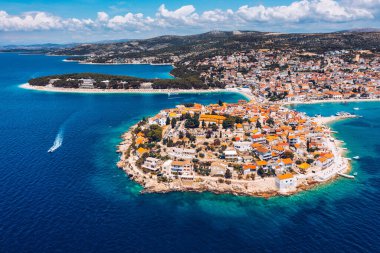 Aerial view of Primosten old town on the islet, Dalmatia, Croatia. Primosten, Sibenik Knin County, Croatia. Resort town on the Adriatic coast. Aerial view of adriatic town Primosten, Croatia