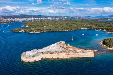 Aerial shot of St. Nicholas Fortress near Sibenik in Croatia. Old St. Nicholas fortress at Sibenik bay entrance, Dalmatia, Croatia, drone aerial shot of beautiful blue coastline seascape