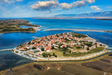 Historic town of Nin laguna aerial view with Velebit mountain background, Dalmatia region of Croatia. Aerial view of the famous Nin lagoon and medieval in Croatia