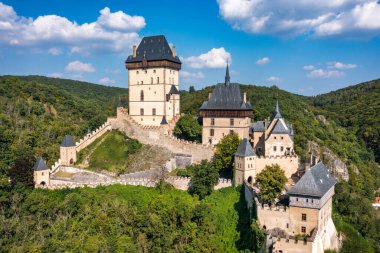 Royal Castle Karlstejn. Central Bohemia, Karlstejn village, Czechia. Aerial view to The Karlstejn castle. Royal palace founded King Charles IV. Amazing gothic monument in Czech Republic, Europe.