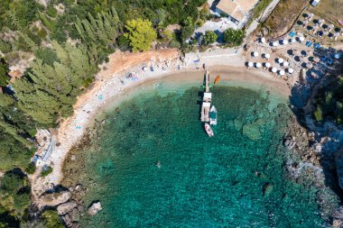 Picturesque seaside of Paleokastritsa, Corfu, Greece. Beautiful bay in Paleokastritsa in Corfu island, Greece. Panoramic view of Palaiokastritsa, boats and beach Corfu, Greece
