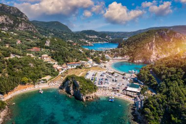 Picturesque seaside of Paleokastritsa, Corfu, Greece. Beautiful bay in Paleokastritsa in Corfu island, Greece. Panoramic view of Palaiokastritsa, boats and beach Corfu, Greece