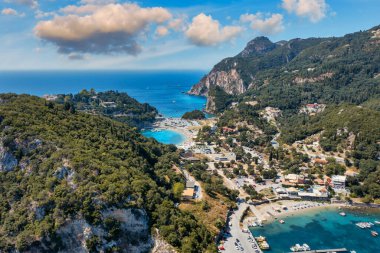 Picturesque seaside of Paleokastritsa, Corfu, Greece. Beautiful bay in Paleokastritsa in Corfu island, Greece. Panoramic view of Palaiokastritsa, boats and beach Corfu, Greece