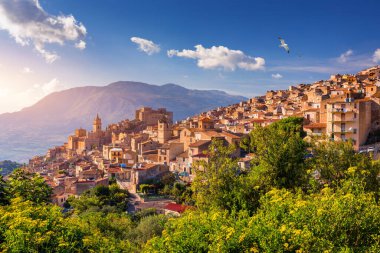 Caccamo, Sicily. Medieval Italian city with the Norman Castle in Sicily mountains, Italy. View of Caccamo town on the hill with mountains in the background, Sicily, Italy. clipart