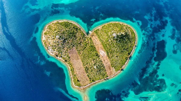 stock image Aerial view of the heart shaped Galesnjak island on the adriatic coast, Zadar, Croatia. Heart shaped island of Galesnjak in Zadar archipelago aerial view, Dalmatia region of Croatia.