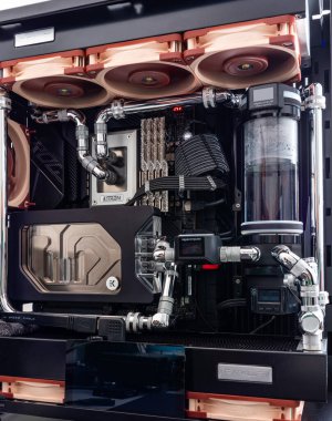 Prague, Czech Republic - 21 July 2021: Close-up of high performance Desktop PC and water cooling system with multicolored LED RGB light show status on working, interior on Computer PC Case and DIY