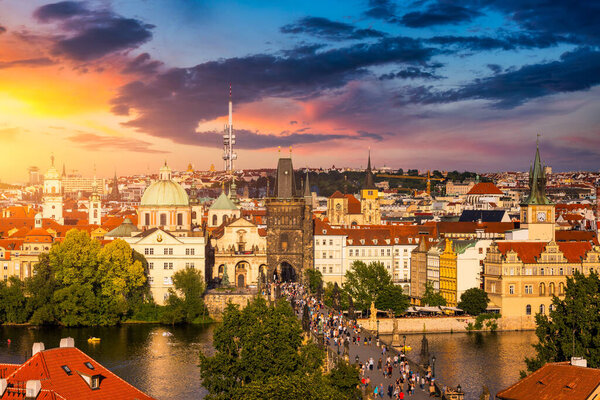 Old town of Prague. Czech Republic over river Vltava with Charles Bridge on skyline. Prague panorama landscape view with red roofs. Prague view from Petrin Hill, Prague, Czechia.