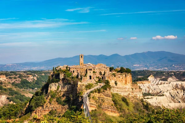 The famous Civita di Bagnoregio on a sunny day. Province of Viterbo, Lazio, Italy. Medieval town on the mountain, Civita di Bagnoregio, popular touristic stop at Tuscany, Italy.