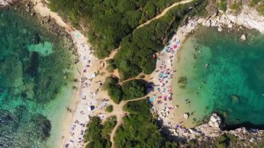 Porto Timoni is an amazing beautiful double beach in Corfu, Greece. Porto Timoni beach at Afionas is a paradise double beach with crystal clear azure water in Corfu, Ionian island, Greece, Europe