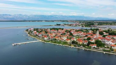 Historic town of Nin laguna aerial view with Velebit mountain background, Dalmatia region of Croatia. Aerial view of the famous Nin lagoon and medieval in Croatia