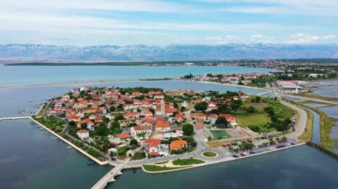 Historic town of Nin laguna aerial view with Velebit mountain background, Dalmatia region of Croatia. Aerial view of the famous Nin lagoon and medieval in Croatia