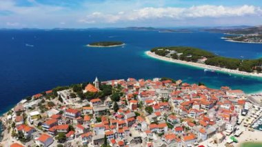 Aerial view of Primosten old town on the islet, Dalmatia, Croatia. Primosten, Sibenik Knin County, Croatia. Resort town on the Adriatic coast. Aerial view of adriatic town Primosten, Croatia
