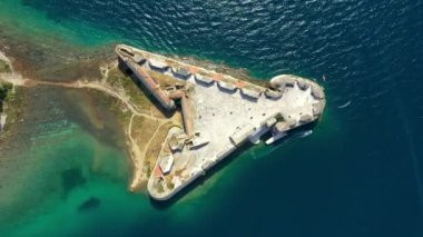 Aerial shot of St. Nicholas Fortress near Sibenik in Croatia. Old St. Nicholas fortress at Sibenik bay entrance, Dalmatia, Croatia, drone aerial shot of beautiful blue coastline seascape