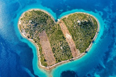 Aerial view of the heart shaped Galesnjak island on the adriatic coast, Zadar, Croatia. Heart shaped island of Galesnjak in Zadar archipelago aerial view, Dalmatia region of Croatia.