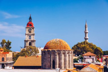 Medieval arched street in the old town of Rhodes, Greece. Rhodes old town in Rhodes island in Greece. Historical streets of old town Rhodes with flowers in Rhodes, Dodecanese, Greece