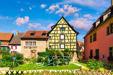 Traditional timbered house in Turckheim, Alsace, France. One of the famous cities in Alsace scenic route near Colmar, France. Colorful traditional french houses in Turckheim town of Alsace, France. clipart