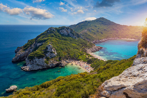 Porto Timoni is an amazing beautiful double beach in Corfu, Greece. Porto Timoni beach at Afionas is a paradise double beach with crystal clear azure water in Corfu, Ionian island, Greece, Europe