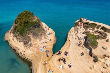 Famous Canal D'amour in Sidari, Corfu island, Greece. Famous Canal d'Amour beach with beautiful rocky coastline in amazing blue Ionian Sea in Sidari holiday village on Corfu island in Greece. clipart