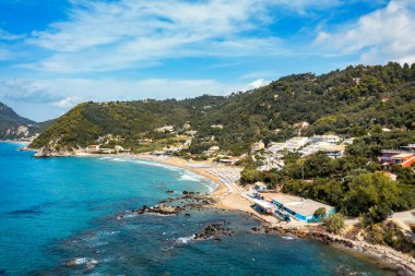 Aerial drone view over western coast and Glyfada beach, Island of Corfu, Greece. Glyfada Beach at Corfu Greece during the day. 