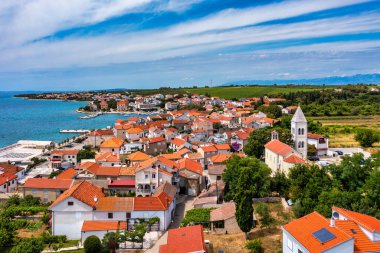 Petrcane village tourist destination coastline aerial panoramic view, Dalmatia region of Croatia. Aerial top view of village Petrcane, Croatia. Petrcane aerial view, Dalmatia region of Croatia