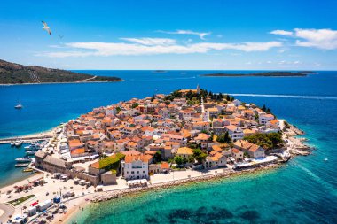 Aerial view of Primosten old town on the islet, Dalmatia, Croatia. Primosten, Sibenik Knin County, Croatia. Resort town on the Adriatic coast. Aerial view of adriatic town Primosten, Croatia