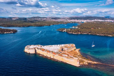 Aerial shot of St. Nicholas Fortress near Sibenik in Croatia. Old St. Nicholas fortress at Sibenik bay entrance, Dalmatia, Croatia, drone aerial shot of beautiful blue coastline seascape