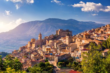 Caccamo, Sicily. Medieval Italian city with the Norman Castle in Sicily mountains, Italy. View of Caccamo town on the hill with mountains in the background, Sicily, Italy. clipart