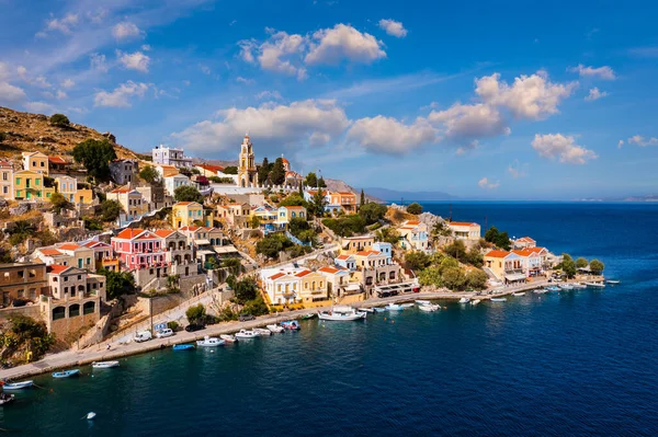 stock image Aerial view of the beautiful greek island of Symi (Simi) with colourful houses and small boats. Greece, Symi island, view of the town of Symi (near Rhodes), Dodecanese.