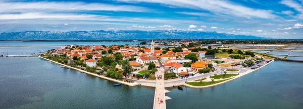 Historic town of Nin laguna aerial view with Velebit mountain background, Dalmatia region of Croatia. Aerial view of the famous Nin lagoon and medieval in Croatia