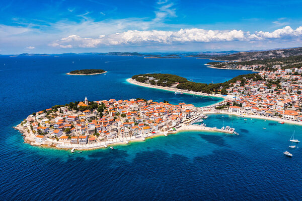 Aerial view of Primosten old town on the islet, Dalmatia, Croatia. Primosten, Sibenik Knin County, Croatia. Resort town on the Adriatic coast. Aerial view of adriatic town Primosten, Croatia