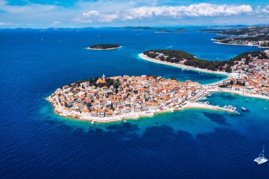 Aerial view of Primosten old town on the islet, Dalmatia, Croatia. Primosten, Sibenik Knin County, Croatia. Resort town on the Adriatic coast. Aerial view of adriatic town Primosten, Croatia