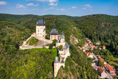 Royal Castle Karlstejn. Central Bohemia, Karlstejn village, Czechia. Aerial view to The Karlstejn castle. Royal palace founded King Charles IV. Amazing gothic monument in Czech Republic, Europe.