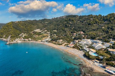 Aerial drone view over western coast and Glyfada beach, Island of Corfu, Greece. Glyfada Beach at Corfu Greece during the day. 