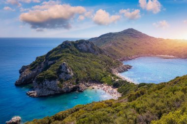 Porto Timoni is an amazing beautiful double beach in Corfu, Greece. Porto Timoni beach at Afionas is a paradise double beach with crystal clear azure water in Corfu, Ionian island, Greece, Europe