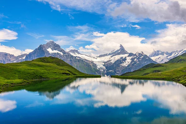 stock image Bachalpsee lake at dawn, Bernese Oberland, Switzerland. Alpine view of the Mt. Schreckhorn and Wetterhorn. Location Bachalpsee in Swiss alps, Grindelwald valley, Interlaken, Europe, Switzerland.