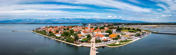 Historic town of Nin laguna aerial view with Velebit mountain background, Dalmatia region of Croatia. Aerial view of the famous Nin lagoon and medieval in Croatia