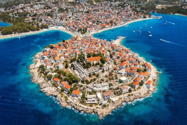 Aerial view of Primosten old town on the islet, Dalmatia, Croatia. Primosten, Sibenik Knin County, Croatia. Resort town on the Adriatic coast. Aerial view of adriatic town Primosten, Croatia