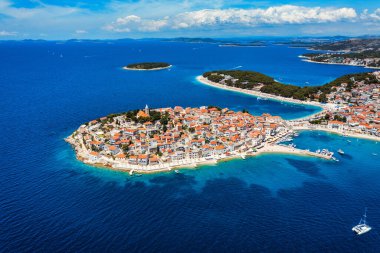 Aerial view of Primosten old town on the islet, Dalmatia, Croatia. Primosten, Sibenik Knin County, Croatia. Resort town on the Adriatic coast. Aerial view of adriatic town Primosten, Croatia