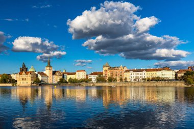 Old Town of Prague in Czechia. Prague, Czech Republic. Vltava River and old buildings across the river. Concept of world travel, sightseeing and tourism.