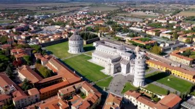 Pisa Cathedral and the Leaning Tower in a sunny day in Pisa, Italy. Pisa Cathedral with Leaning Tower of Pisa on Piazza dei Miracoli in Pisa, Tuscany, Italy.