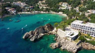 Picturesque seaside of Paleokastritsa, Corfu, Greece. Beautiful bay in Paleokastritsa in Corfu island, Greece. Panoramic view of Palaiokastritsa, boats and beach Corfu, Greece